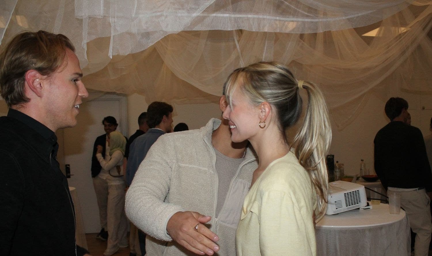 Two guests greeting each other at a SKULPT gathering