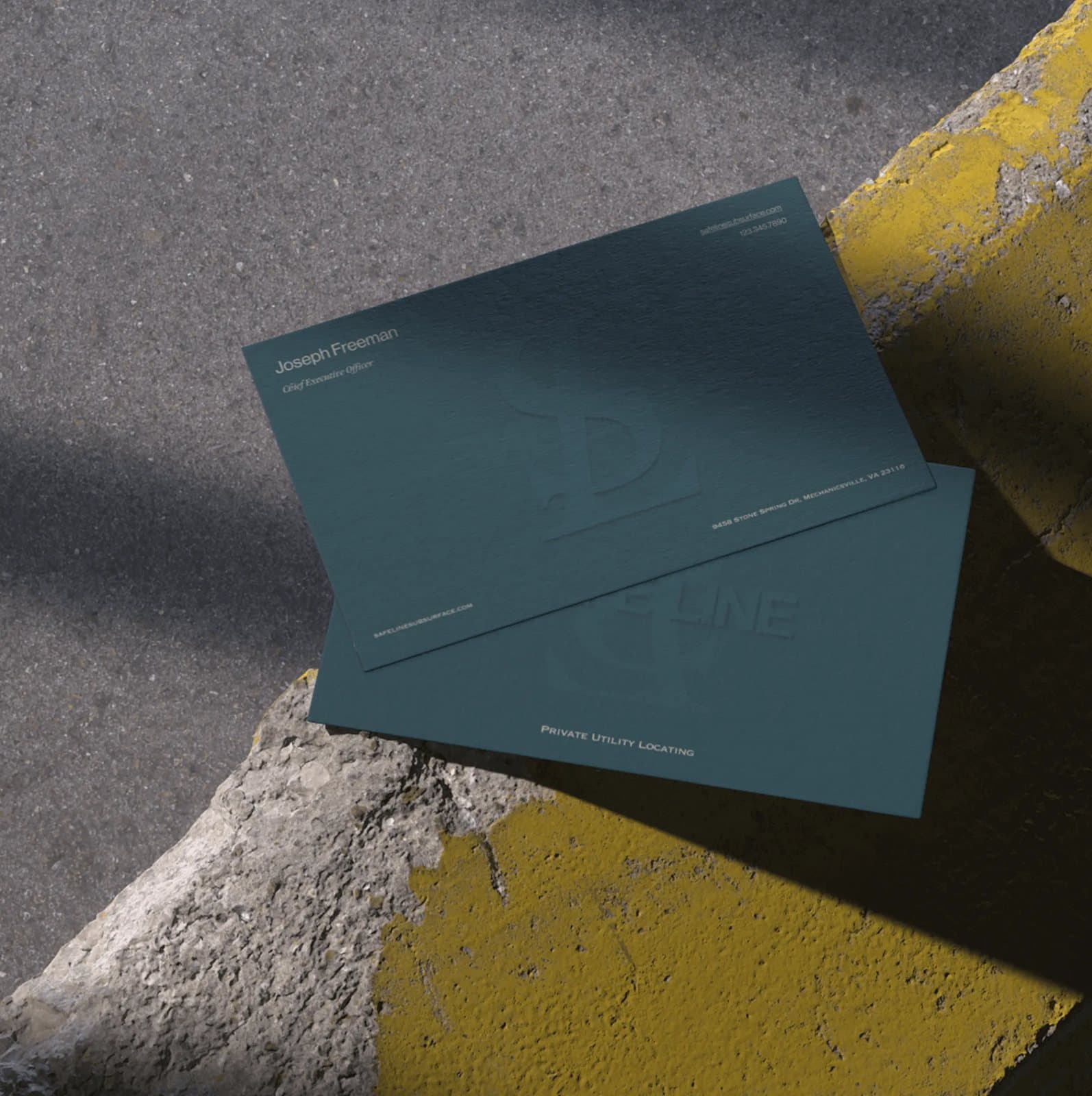 SafeLine business cards on concrete
